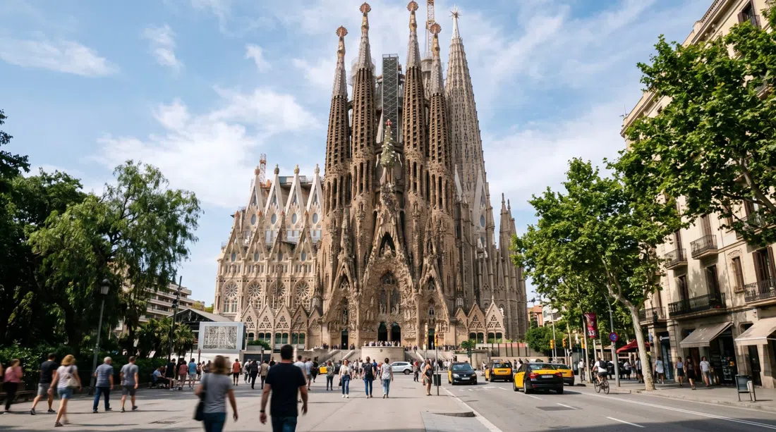 Gaudí’s Sagrada Família rising above Mallorca 401, viewed from the plaza with the Nativity façade and the tower’s vertical lines dominating the frame