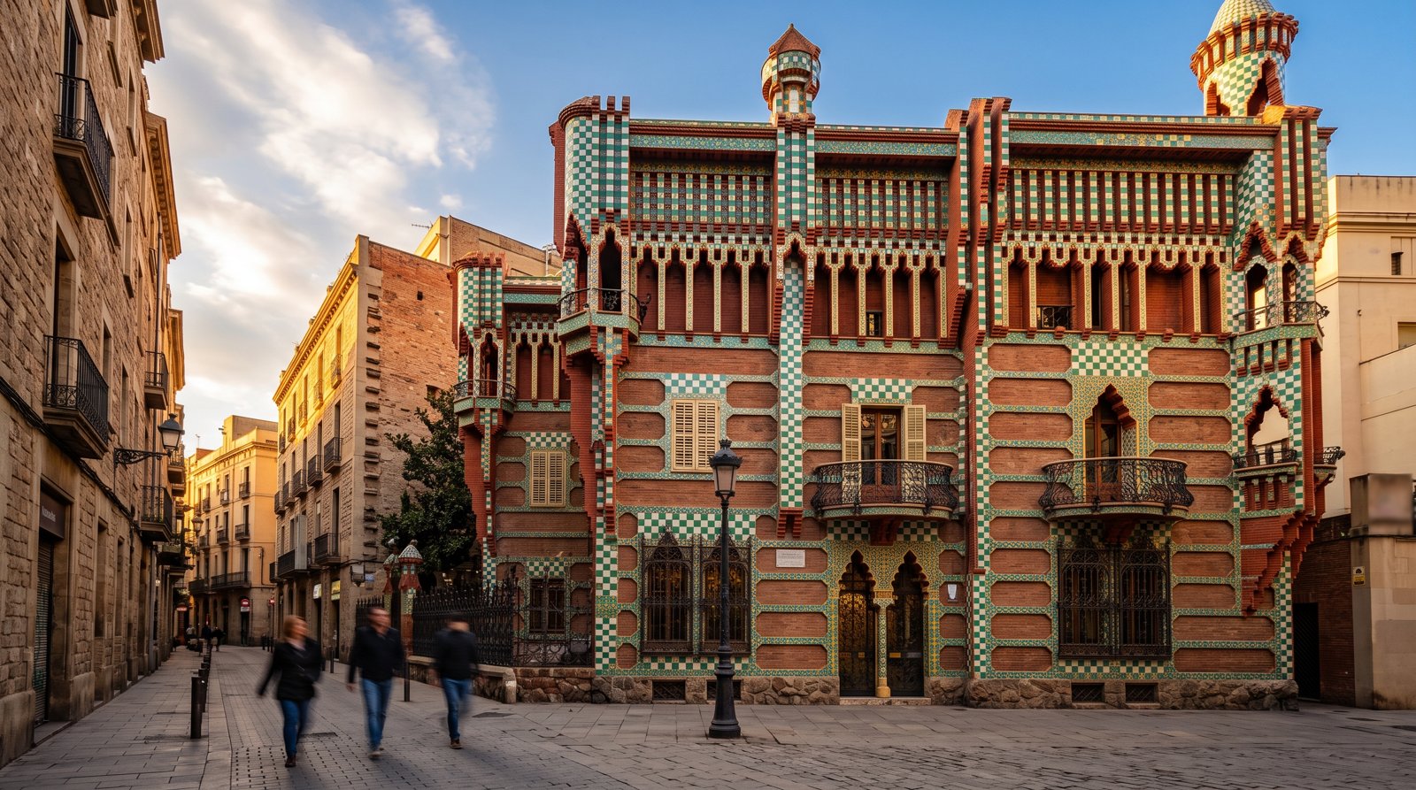 Casa Vicens on Carrer de les Carolines, its green-and-white ceramic tiles and Mudéjar details glowing in late afternoon light